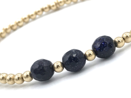 Armband Jinte met real gold plated balletjes en donkerblauw goudsteen