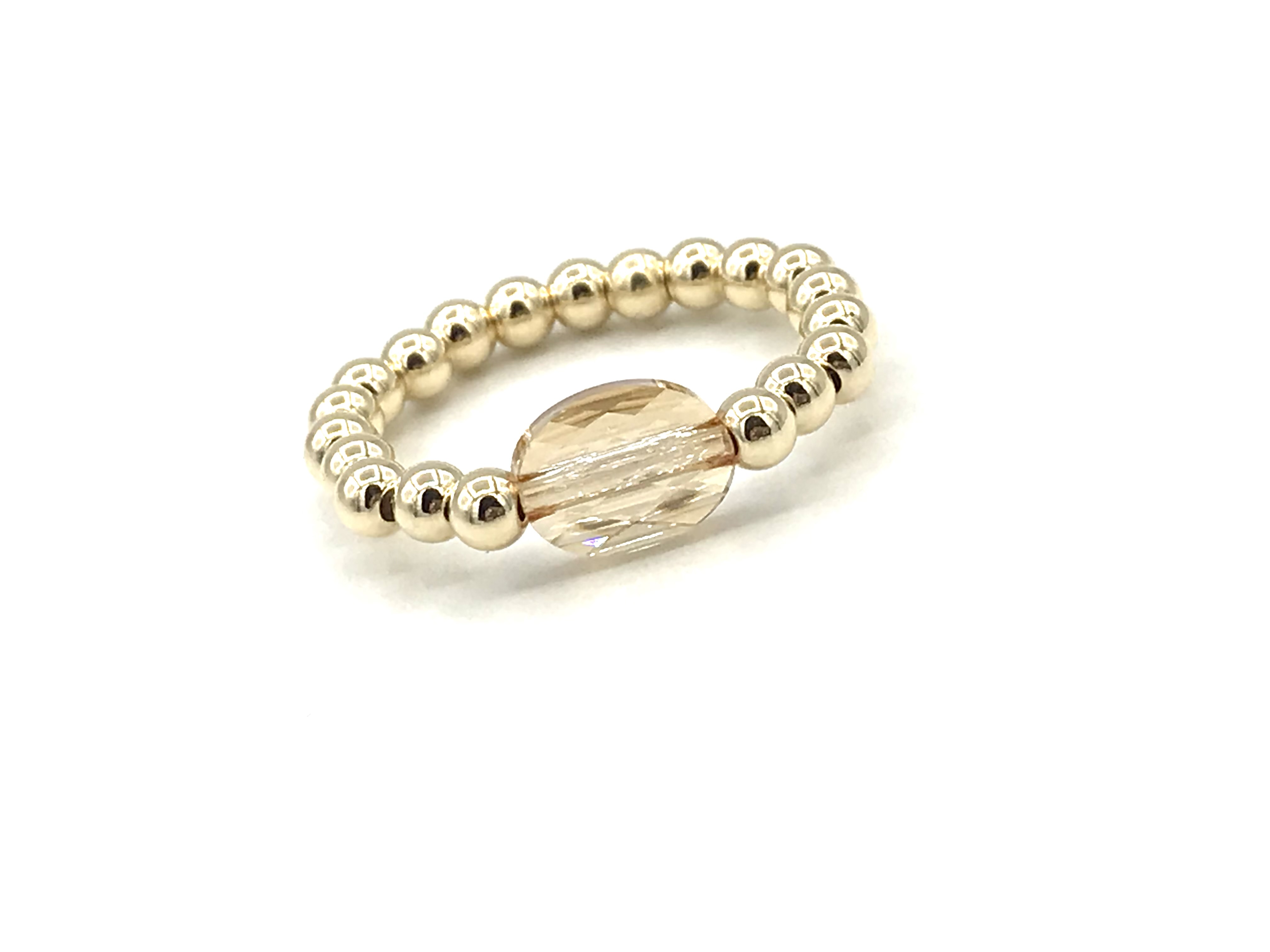 Stretch ring Merle met champagne kleurig Swarovski crystal en real gold plated balletjes