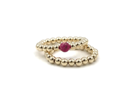 Stretch ring Puk met real gold plated balletjes en roze edelsteen