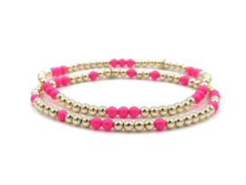 Armband Mirte met real gold plated balletjes en neon roze Swarovski pareltjes