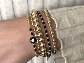 Armband Sienna met real gold plated balletjes en hartje van zwart parelmoer