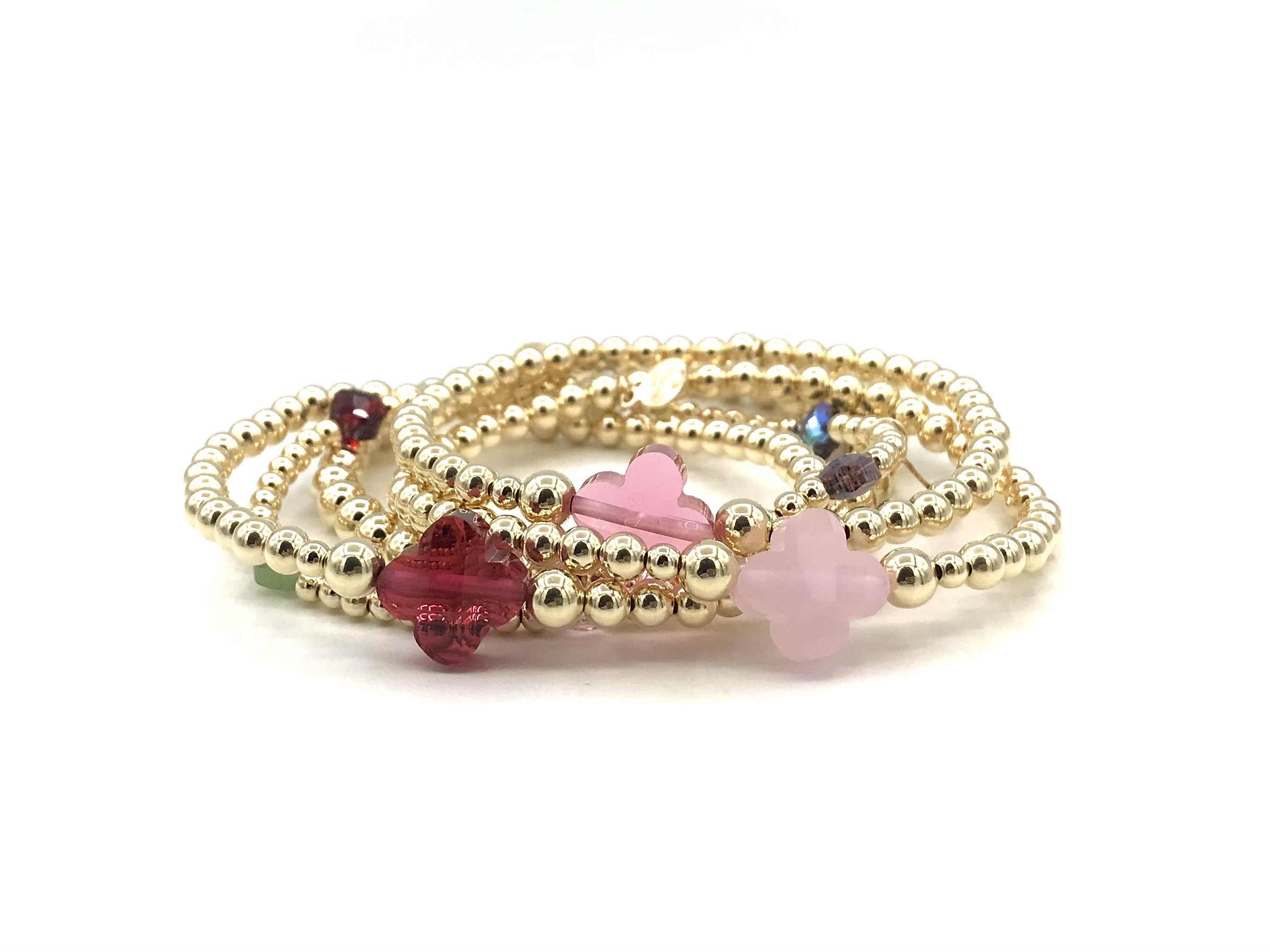 Armband Lizzie pink met goudkleurige real gold plated balletjes en roze klavertje