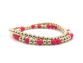 Armband Seline met real gold plated balletjes en neon roze shell