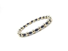 Armband Tatum met real gold plated balletjes en zwarte ovale pareltjes