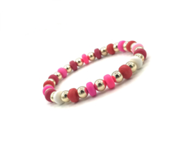 Armband Alisha pink/red  met gekleurde wieltjes en real gold plated balletjes