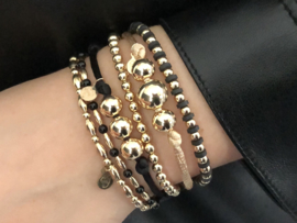 Armband Milana met real gold plated balletjes en zwarte schijfjes