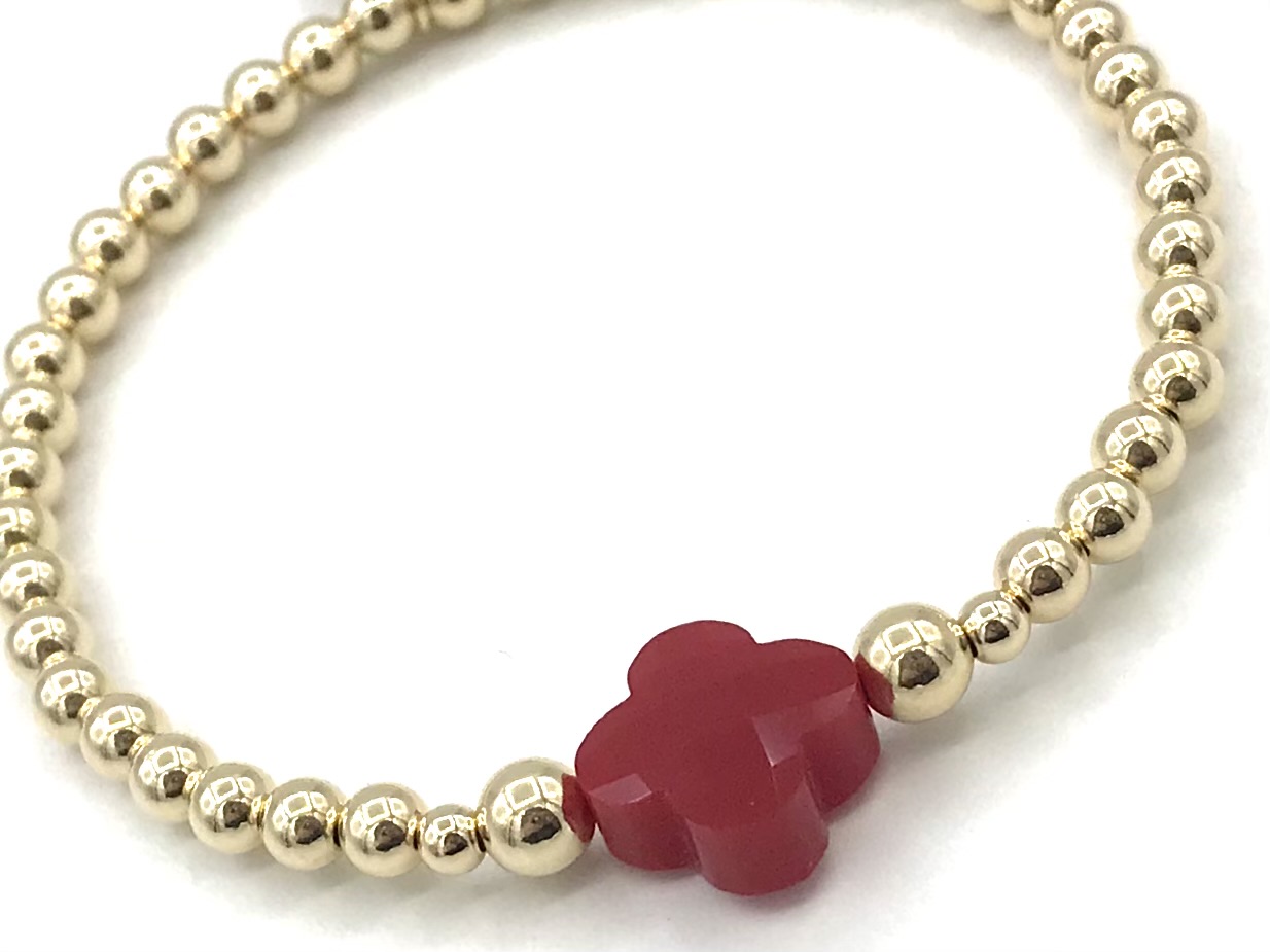 Armband Lizzie red met goudkleurige real gold plated balletjes en rood klavertje