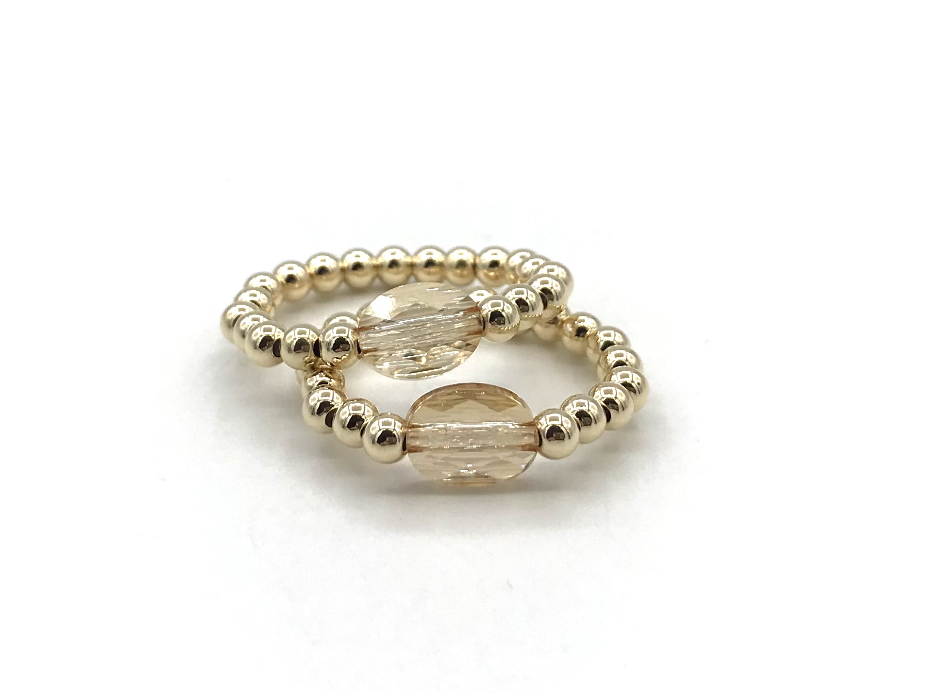Stretch ring Merle met champagne kleurig Swarovski crystal en real gold plated balletjes