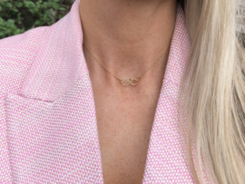 Goudkleurige infinity ketting met hartje