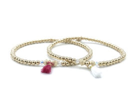 Armband Nore met real gold plated balletjes, Swarovski crystal en wit kwastje