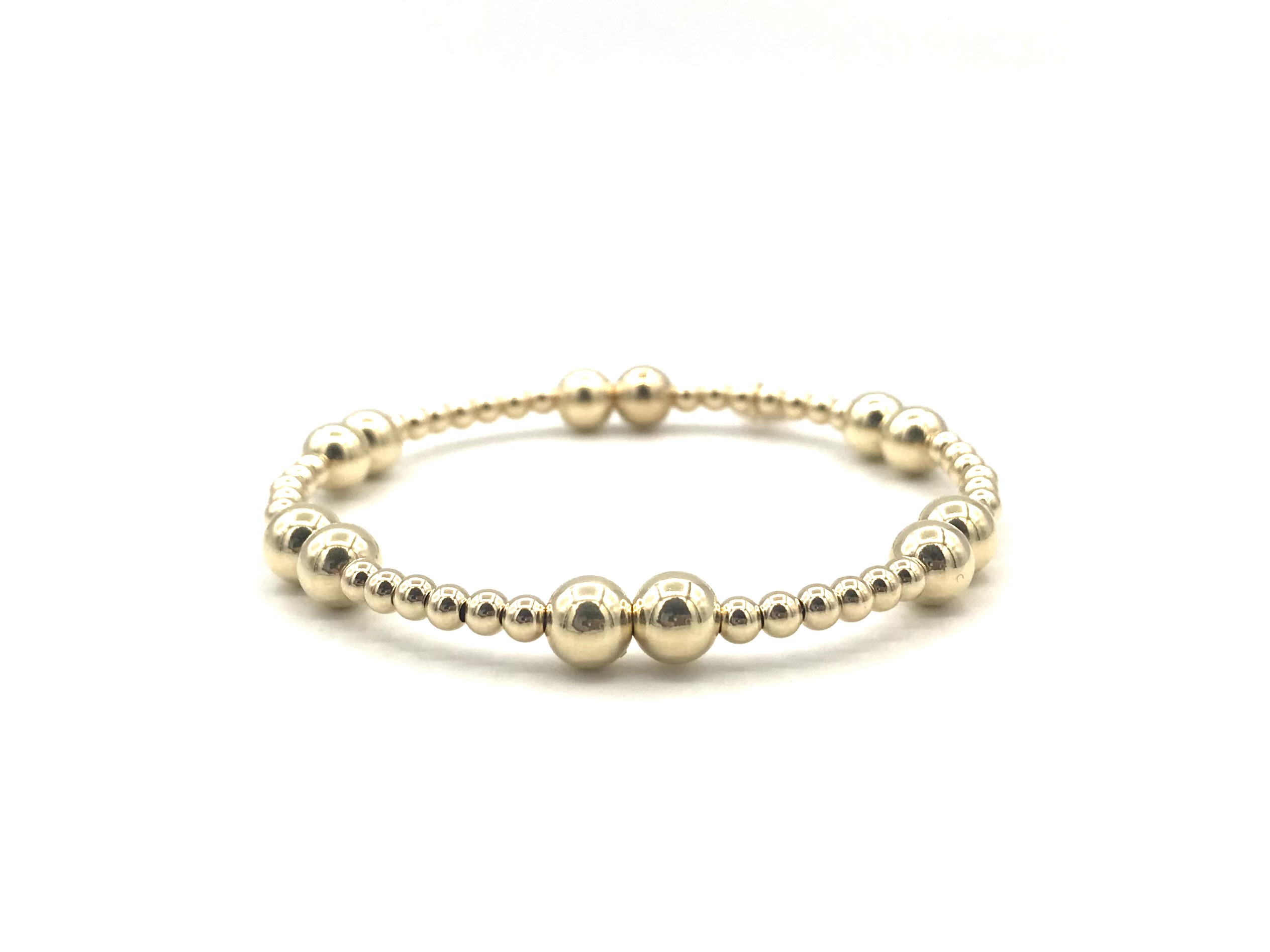 Armband Antonia met real gold plated balletjes in verschillende groottes.