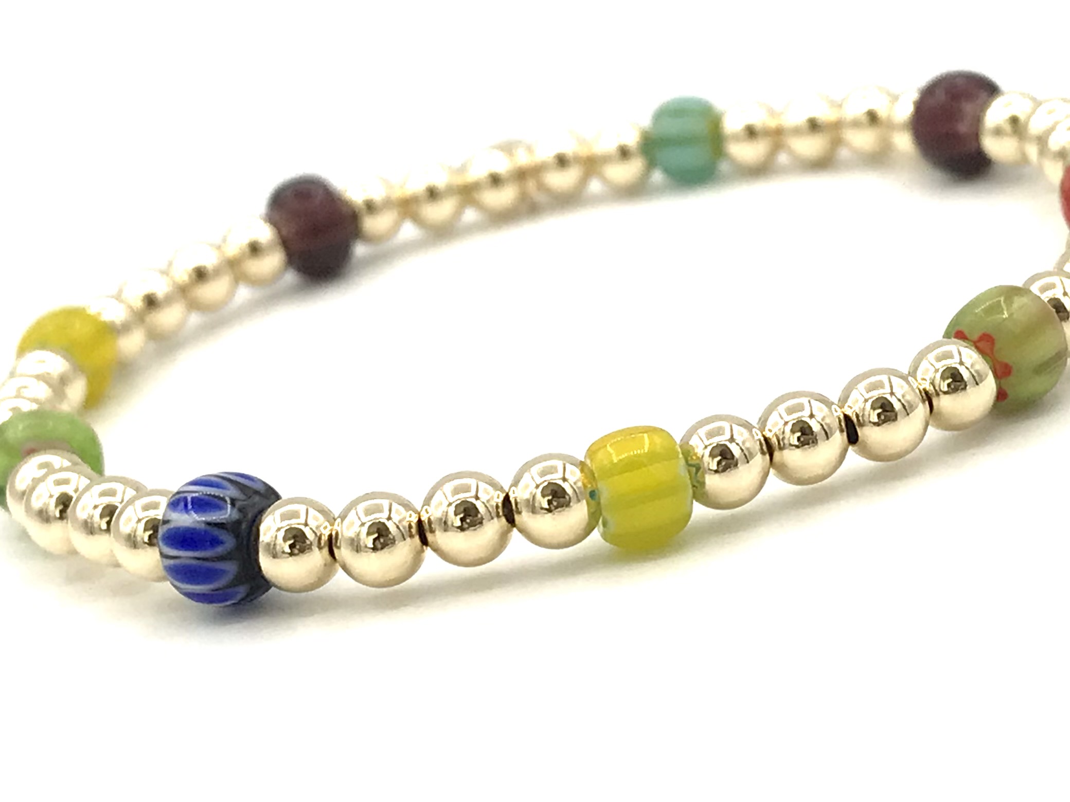 Armband Shanaya met real gold plated balletjes en gekleurde wieltjes.