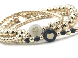 Armband Sienna met real gold plated balletjes en hartje van zwart parelmoer