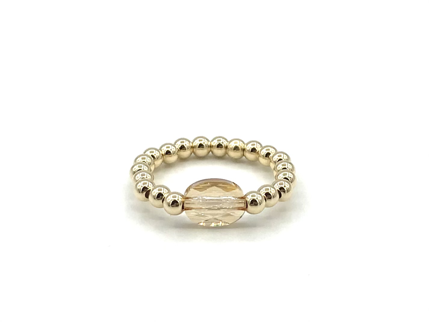 Stretch ring Merle met champagne kleurig Swarovski crystal en real gold plated balletjes