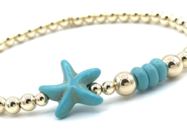 Armband Liza met turquoise zeester en real gold plated balletjes