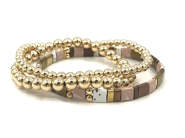 Armand Tila brown met gold plated balletjes en edelsteen