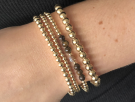 Armband Jayli met bruine gestreepte onyx en real gold plated balletjes