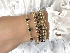 Armband Rania met real gold plated balletjes en bloemetjes van zwarte onyx edelsteen