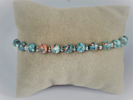 Armband in blauw tinten met rvs kraaltjes