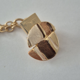 Goudkleurige vestclip (bruin | asymmetrisch rond)