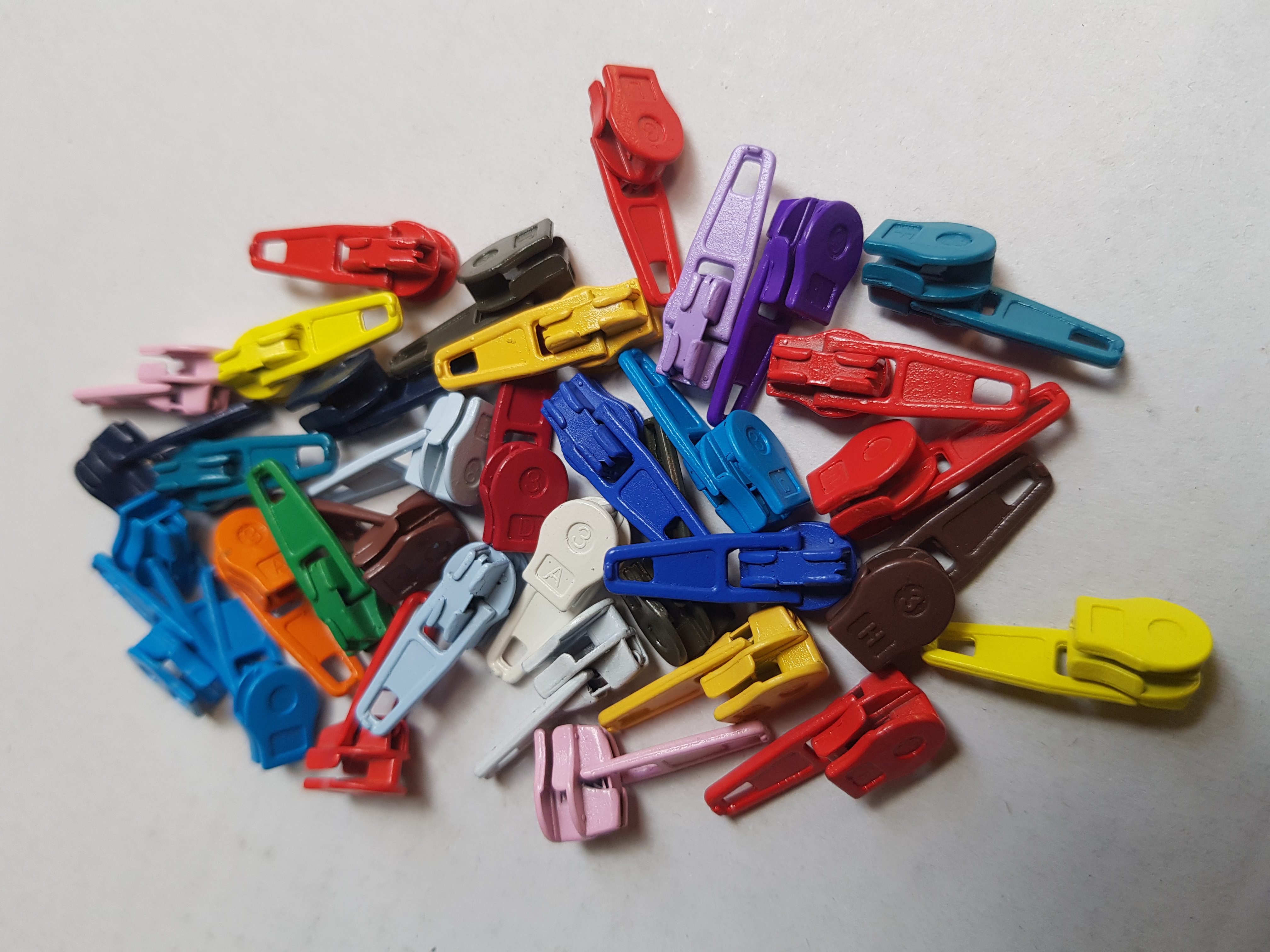 Runners, ritsvoetjes voor ritsen op de rol maat 3, vanaf 0,59