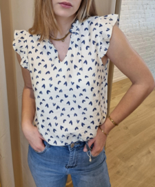 bloesje met volantmouwtjes en frulletjes met hartjesmotief blauw