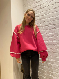 oversized sweater met versiering fuchsia