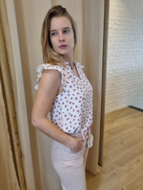 bloesje met volantmouwtjes en frulletjes met hartjesmotief