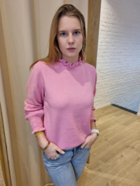 trui met detail aan de pols en hals licht fuchsiaroze