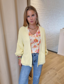 ruime cardigan in gebreid motief lichtgeel