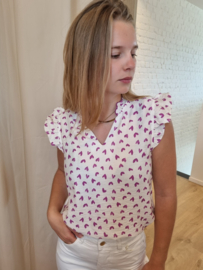 bloesje met volantmouwtjes en frulletjes met hartjesmotief
