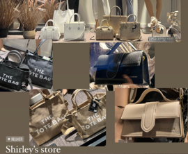 Een grote collectie tassen in de winkel