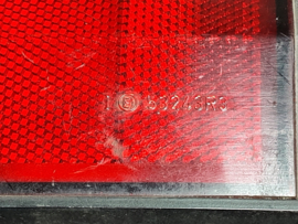 Achterlicht links Opel Manta B met zwarte rand, merk Hella.