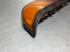 Achterlicht links Opel Manta B met zwarte rand, merk Hella.