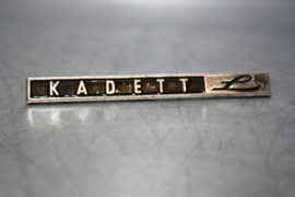 Opel Kadett embleem "L", gebruikt.