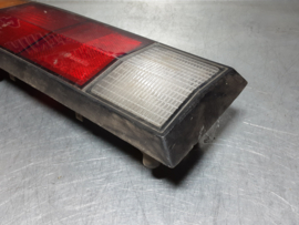 Achterlicht links Opel Manta B met zwarte rand, merk Hella.
