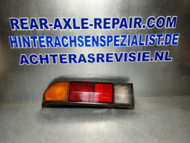 Achterlicht links Opel Manta B met zwarte rand, merk Hella.