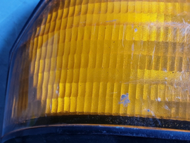 Achterlicht links Opel Manta B met zwarte rand, merk Hella.