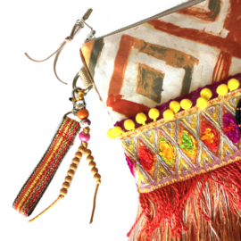 Boho clutch in orange and yellow with fringe