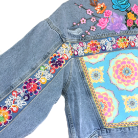 Embellished denim jacket with multi colored flower patches