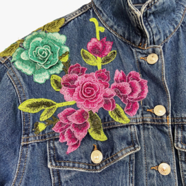 Embellished denim jacket with big colored flowers in Ibiza style