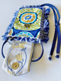 Phone bag in bohemian style with colored pattern and jeans flap