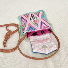 Phone bag in Ibiza style with colored ikat pattern and old jeans flap