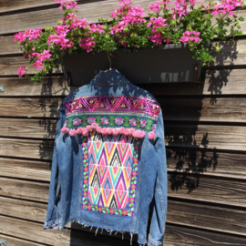 Embellished denim jacket colored with big pompons