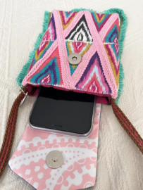 Phone bag in Ibiza style with colored ikat pattern and old jeans flap
