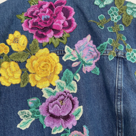 Embellished denim jacket with big colored flowers in Ibiza style