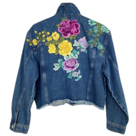 Embellished denim jacket with big colored flowers in Ibiza style