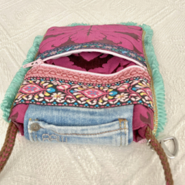Phone bag in Ibiza style with colored ikat pattern and old jeans flap