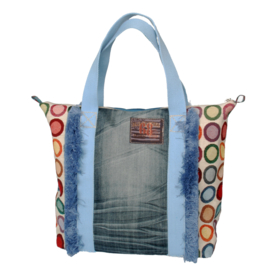 Ibiza tote handbag colored with fringes and jeans