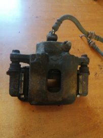Caliper front left-hand, without pads or shims Nissan Bluebird 41011-31E01 T72/ U11 Used part.